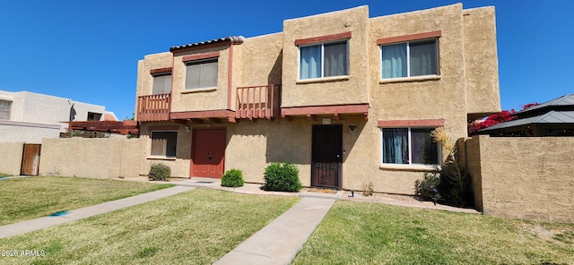 948 S Alma School Rd Unit 71, Mesa, AZ 85210 - pueblo-style house featuring stucco siding and a balcony