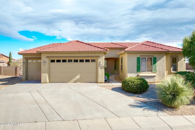 mediterranean / spanish-style house featuring a garage