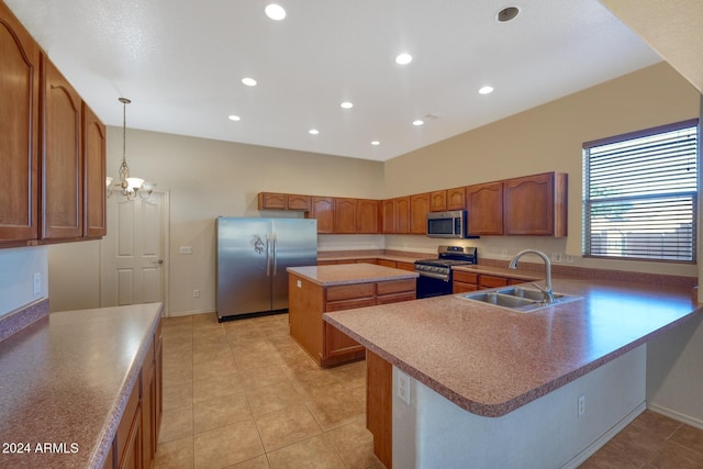 kitchen featuring light tile patterned floors, appliances with stainless steel finishes, a kitchen island, sink, and decorative light fixtures