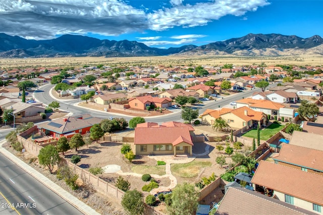 birds eye view of property with a mountain view