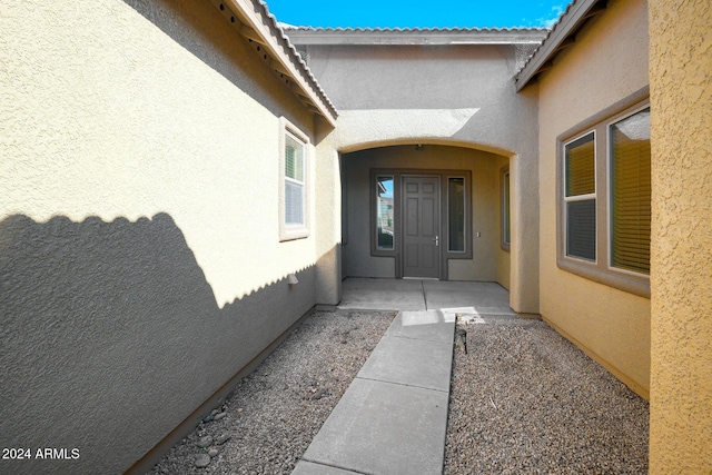 doorway to property with a patio