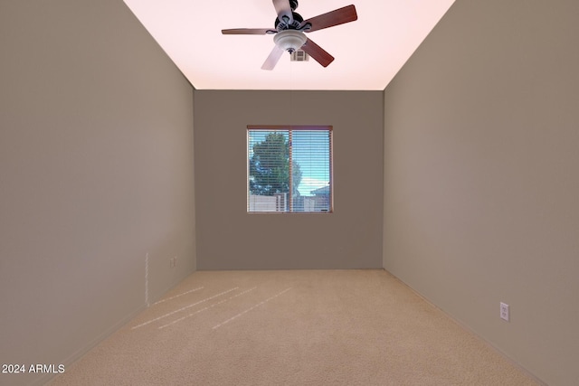 empty room featuring ceiling fan and carpet floors