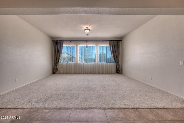 empty room with light colored carpet