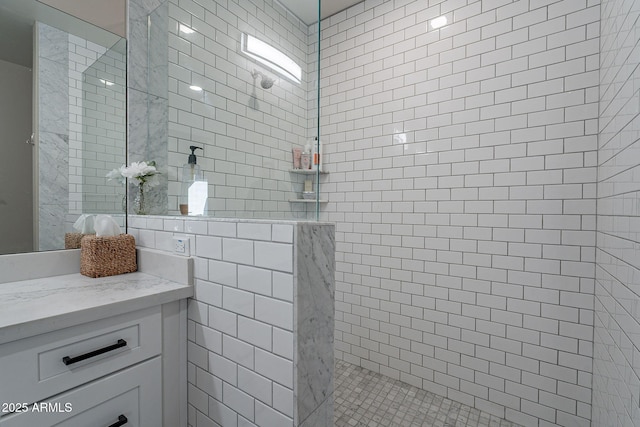 bathroom featuring tile walls and tiled shower