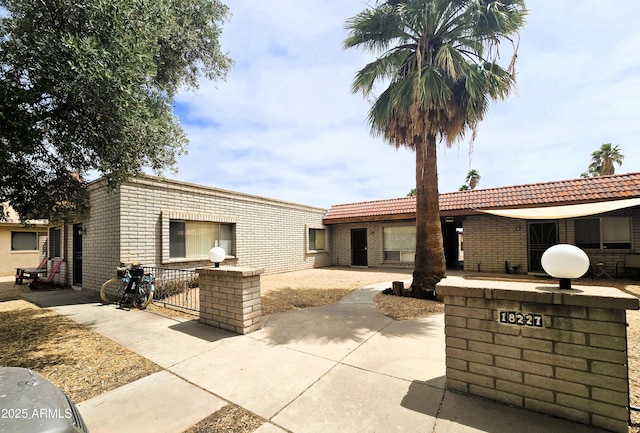 18227 N 40th Pl, Phoenix, AZ 85032 - rear view of property with brick siding, a patio, and fence