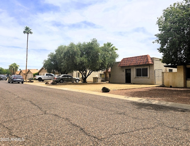 18227 N 40th Pl, Phoenix, AZ 85032 - view of front of house with mansard roof and brick siding