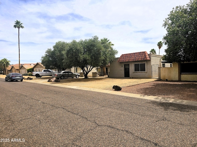 18227 N 40th Pl, Phoenix, AZ 85032 - view of front of house with mansard roof and brick siding