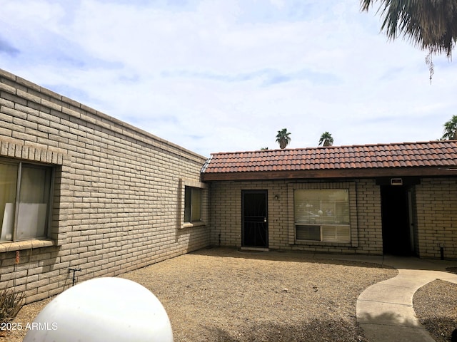 18227 N 40th Pl, Phoenix, AZ 85032 - entrance to property featuring a tiled roof and brick siding