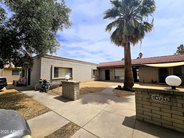 18227 N 40th Pl, Phoenix, AZ 85032 - view of front facade with brick siding and fence