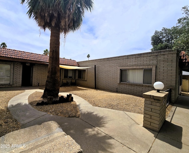 18227 N 40th Pl, Phoenix, AZ 85032 - view of front of house with brick siding and a patio