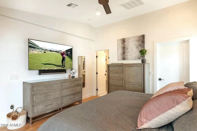 bedroom with ceiling fan and light hardwood / wood-style flooring