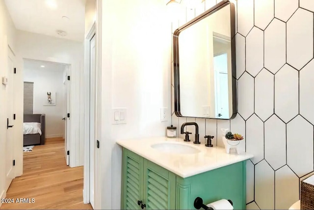 bathroom featuring vanity and hardwood / wood-style flooring