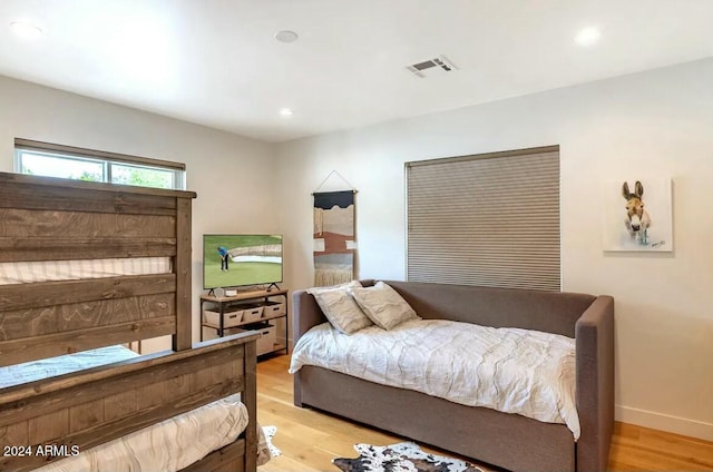 bedroom with light hardwood / wood-style floors