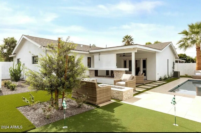 back of house with outdoor lounge area, a fenced in pool, ceiling fan, and a patio area