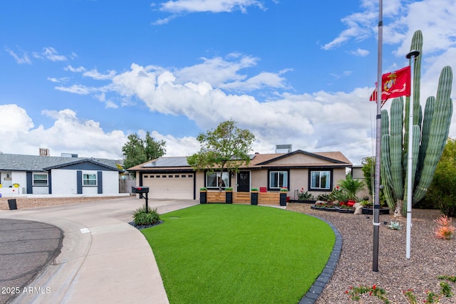 ranch-style house with a garage, a front lawn, and solar panels