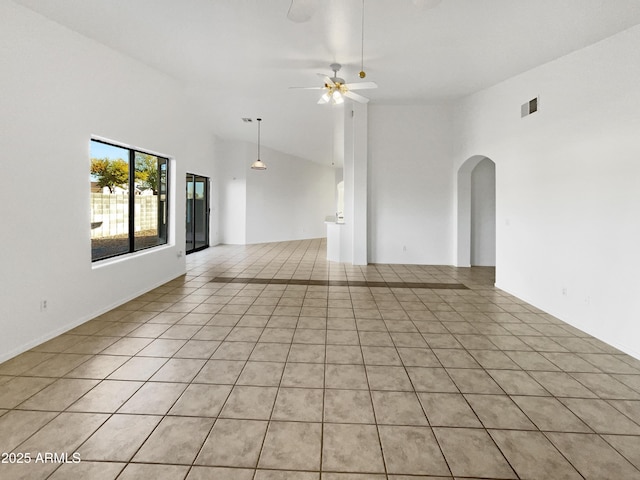 unfurnished room featuring ceiling fan, high vaulted ceiling, and light tile patterned floors