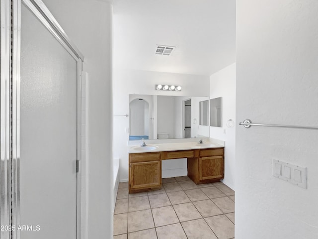 bathroom with vanity, tile patterned floors, and shower with separate bathtub