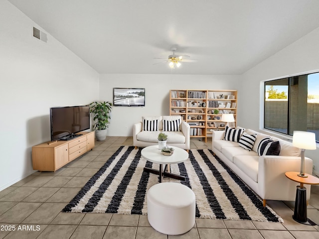 tiled living room featuring lofted ceiling and ceiling fan