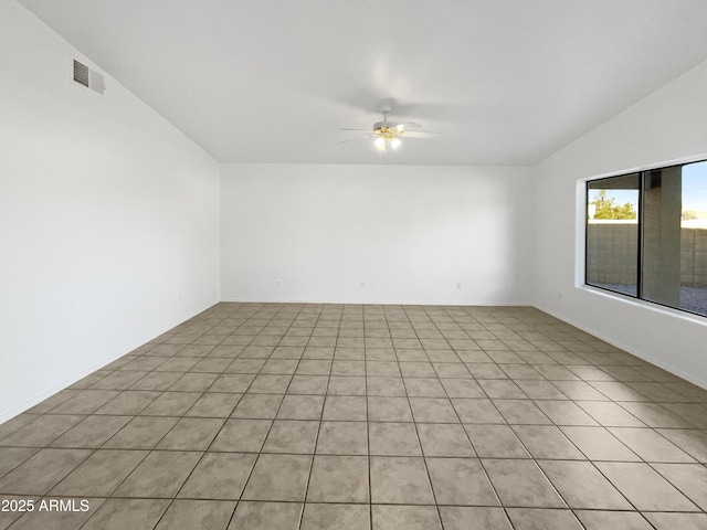 unfurnished room featuring ceiling fan and lofted ceiling