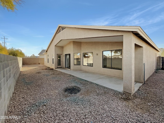 back of property with a patio area