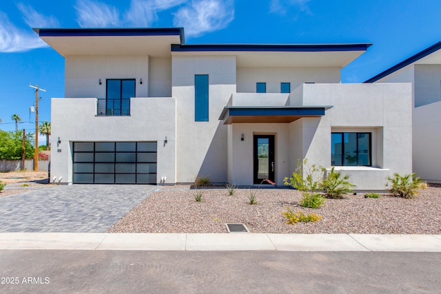 100 W Northern Ave Unit 12, Phoenix, AZ 85021 - contemporary home with decorative driveway, a garage, stucco siding, and a balcony