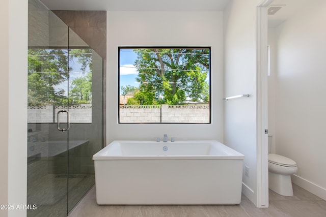 100 W Northern Ave Unit 12, Phoenix, AZ 85021 - full bath featuring toilet, a freestanding bath, plenty of natural light, and a stall shower