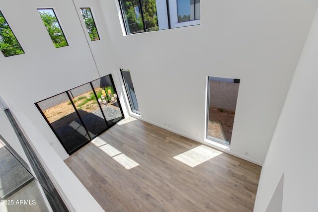 100 W Northern Ave Unit 12, Phoenix, AZ 85021 - entrance foyer featuring baseboards, a high ceiling, and wood finished floors
