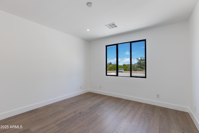 100 W Northern Ave Unit 12, Phoenix, AZ 85021 - unfurnished room featuring recessed lighting, baseboards, visible vents, and wood finished floors
