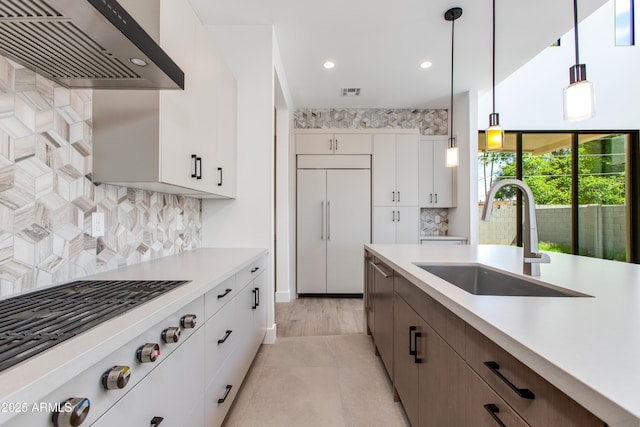 100 W Northern Ave Unit 12, Phoenix, AZ 85021 - kitchen featuring light countertops, stainless steel gas stovetop, a sink, and ventilation hood