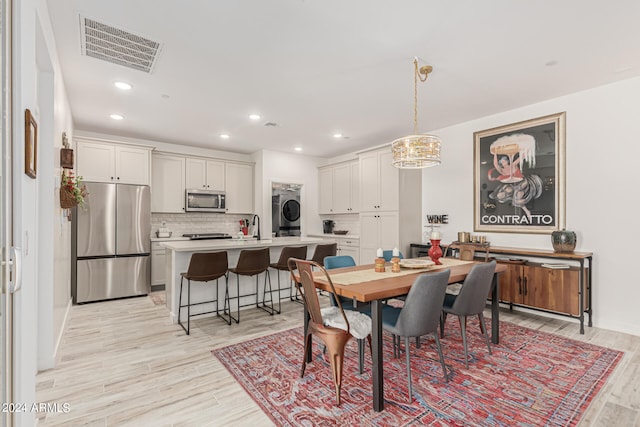 dining space with light hardwood / wood-style flooring