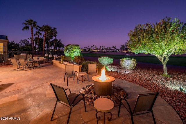 view of patio terrace at dusk