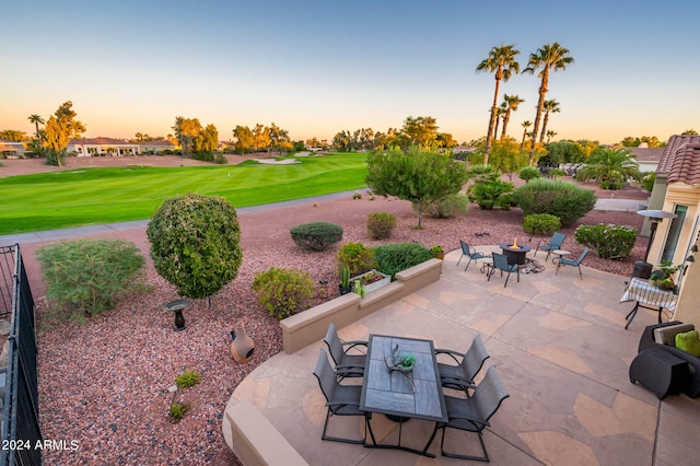 view of patio terrace at dusk