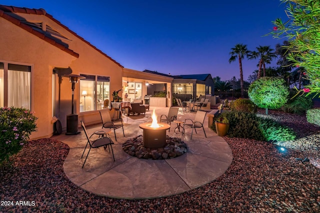 view of patio terrace at dusk