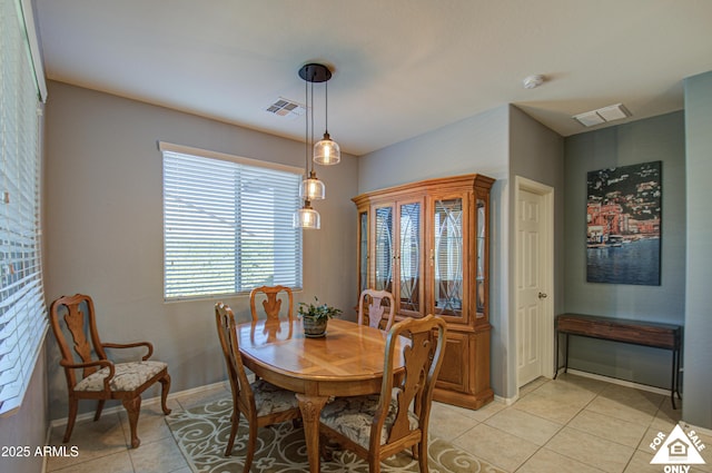 dining space with light tile patterned floors