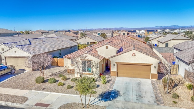 view of front of house featuring a mountain view and a garage