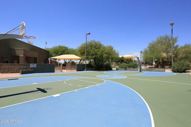 view of sport court with a gazebo, community basketball court, and fence