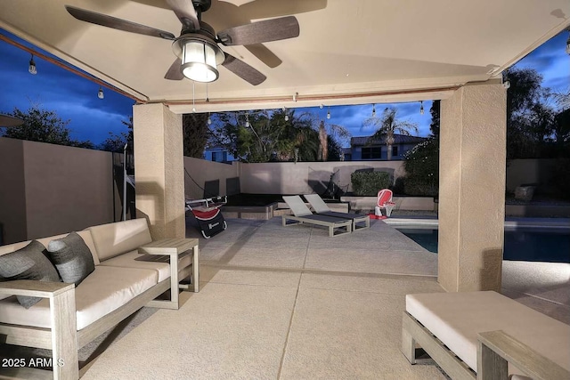 view of patio / terrace featuring outdoor lounge area, a ceiling fan, and a fenced backyard