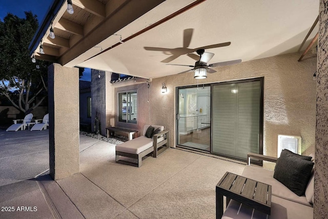 view of patio featuring a ceiling fan