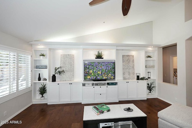 living area featuring dark wood-style floors, built in features, ceiling fan, and lofted ceiling