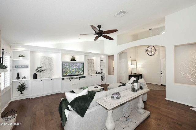 living area featuring visible vents, dark wood-style floors, arched walkways, ceiling fan, and vaulted ceiling