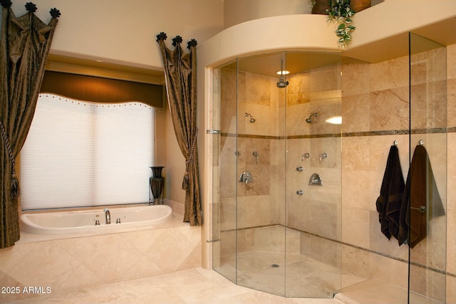 bathroom with shower with separate bathtub