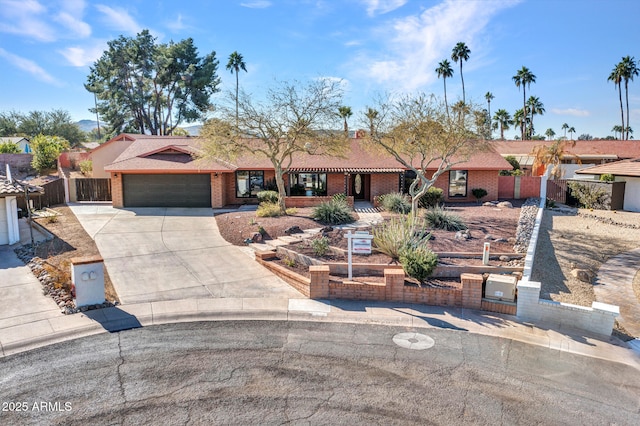 ranch-style home featuring a garage