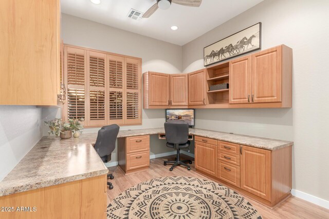 13102 S 177th Dr, Goodyear, AZ 85338 - office with ceiling fan, built in desk, and light wood-type flooring