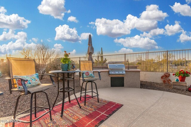 13102 S 177th Dr, Goodyear, AZ 85338 - view of patio featuring grilling area and exterior kitchen