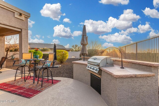 13102 S 177th Dr, Goodyear, AZ 85338 - view of patio / terrace featuring area for grilling and exterior kitchen