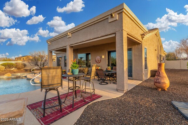 13102 S 177th Dr, Goodyear, AZ 85338 - back of house featuring a fenced in pool and a patio