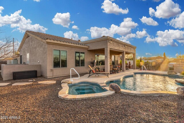 13102 S 177th Dr, Goodyear, AZ 85338 - view of swimming pool featuring an in ground hot tub and a patio