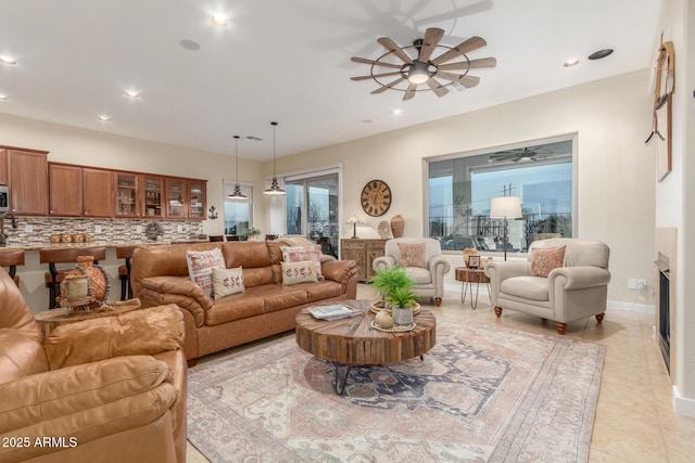 13102 S 177th Dr, Goodyear, AZ 85338 - living room with ceiling fan and light tile patterned floors