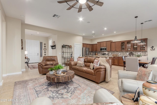 13102 S 177th Dr, Goodyear, AZ 85338 - living room with ceiling fan and light tile patterned floors