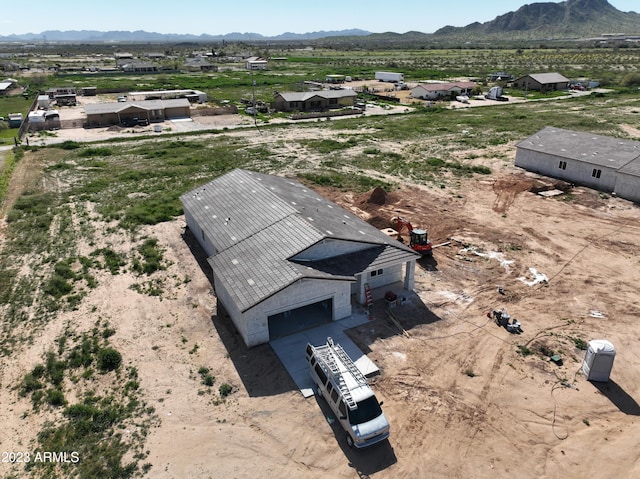 drone / aerial view featuring a mountain view